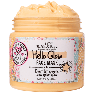 Bella and Bear Hello Glow face mask jar of creamy yellow mask with floral label and open lid