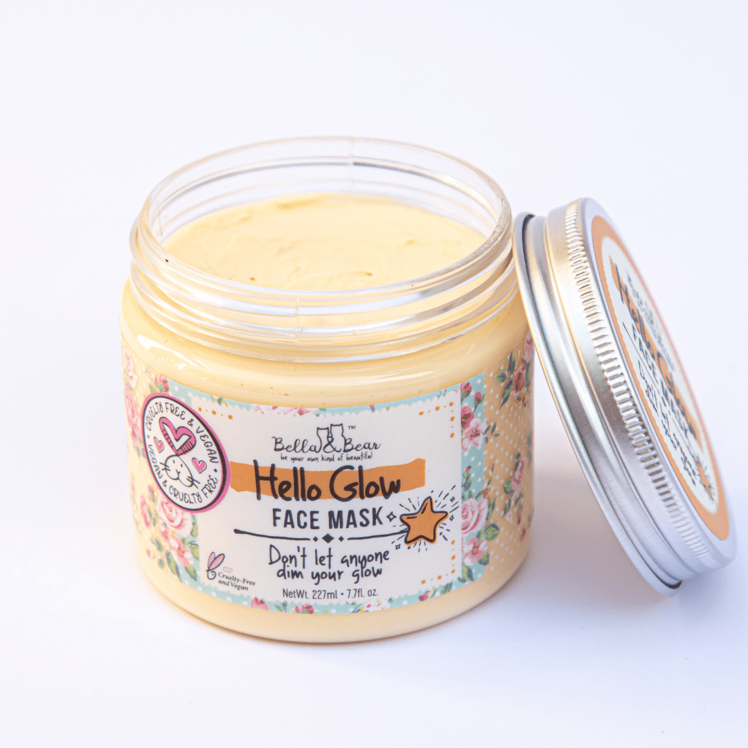 Open jar of Bella and Bear Hello Glow face mask creamy yellow glow boosting mask with floral label