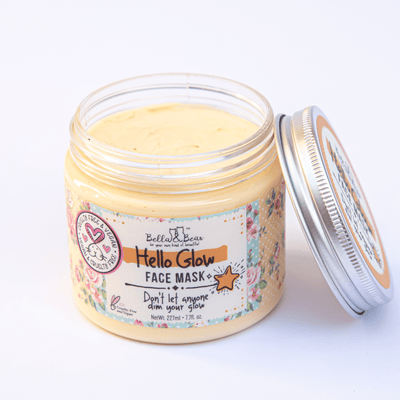 Open jar of Bella and Bear Hello Glow face mask creamy yellow glow boosting mask with floral label